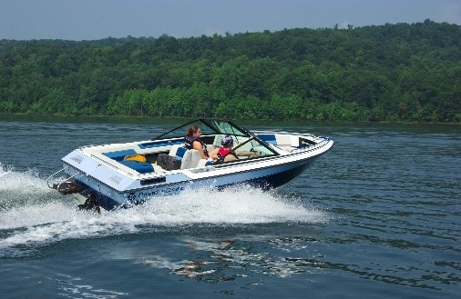 Motorboat with two passengers in Raystown Lake. 