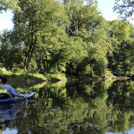 Kayaker paddling down Swatara Creek