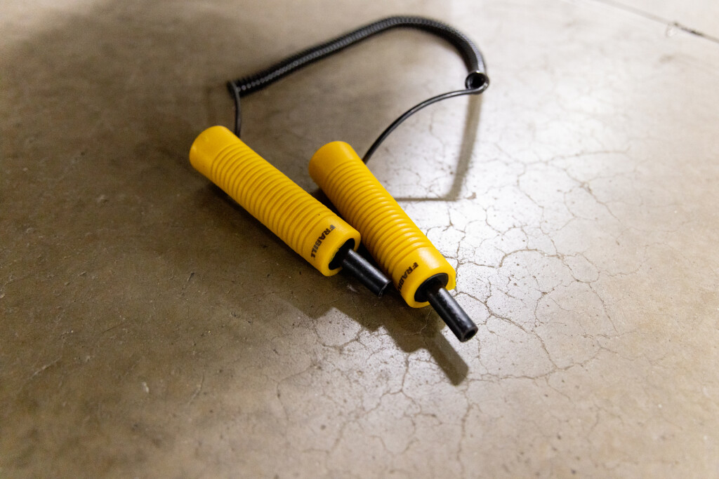 Ice awls sitting on a concrete floor.