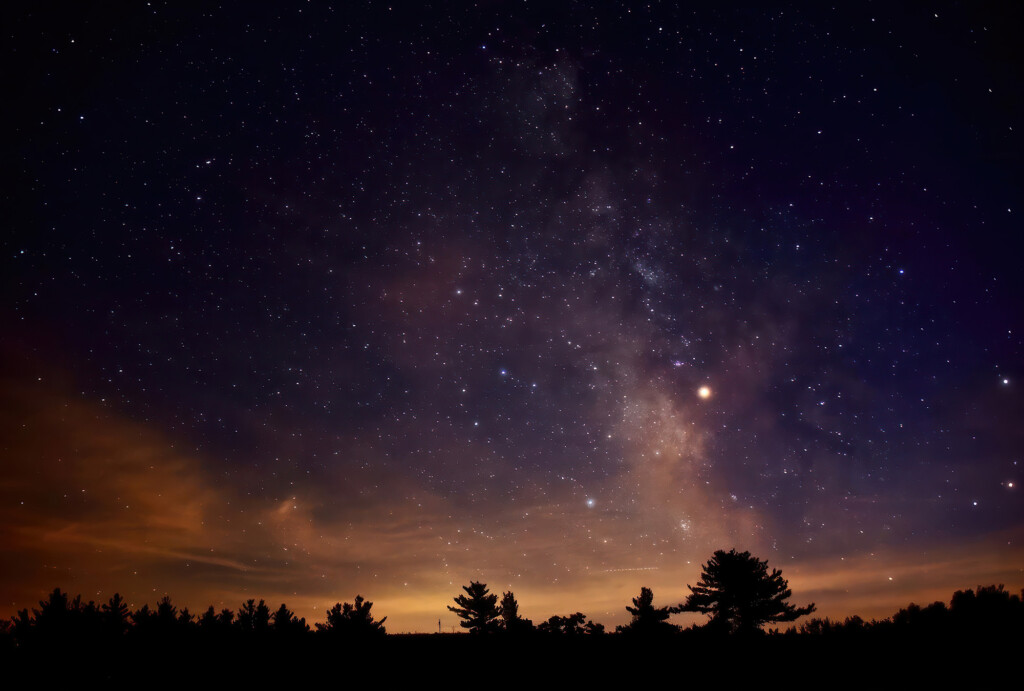 Night sky just at sunset with many stars shining bright in the sky.