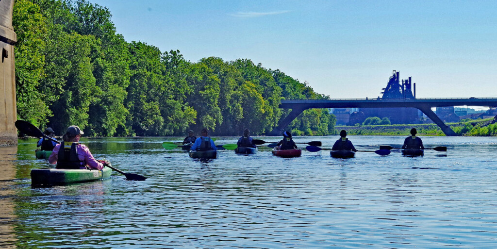 Kayakers paddle on the Lehigh River Water Trail and head downstream from the Sand Island Access in Bethlehem, Northampton County.