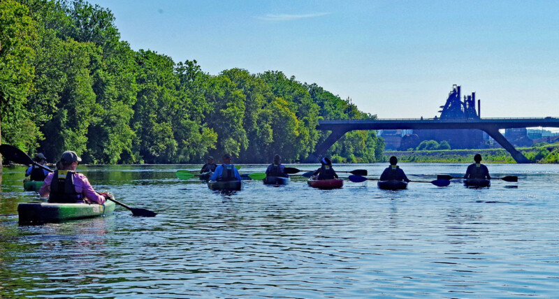 Kayakers paddle on the Lehigh River Water Trail and head downstream from the Sand Island Access in Bethlehem, Northampton County.
